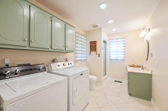 a view of staircase with lots of frames and wooden floor