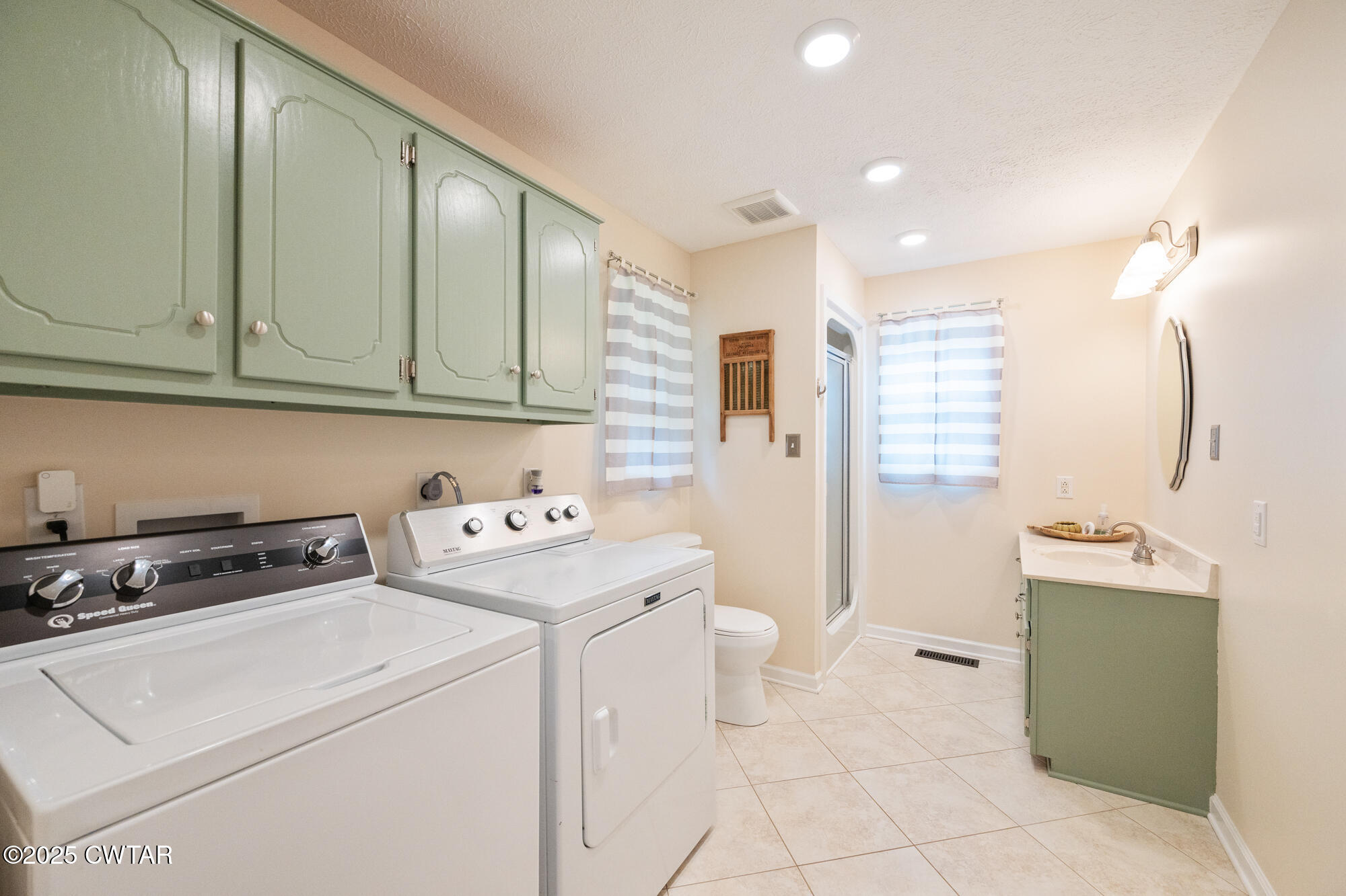 105 Center Hill-Wright Road Reagan, TN 38368 - Photo 21 of 42 a view of a storage & utility room with washer and dryer