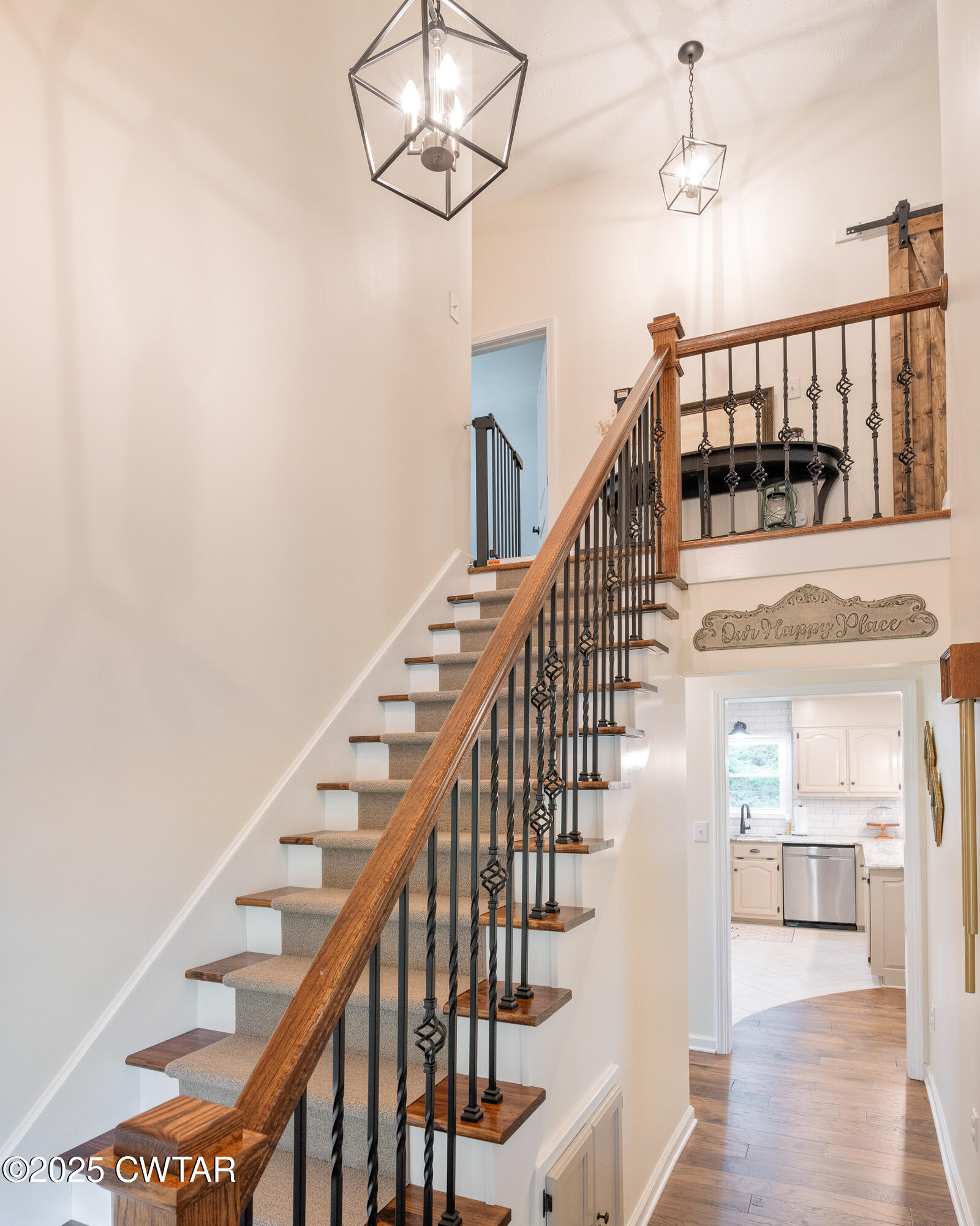 105 Center Hill-Wright Road Reagan, TN 38368 - Photo 22 of 42 a view of staircase with lots of frames and wooden floor