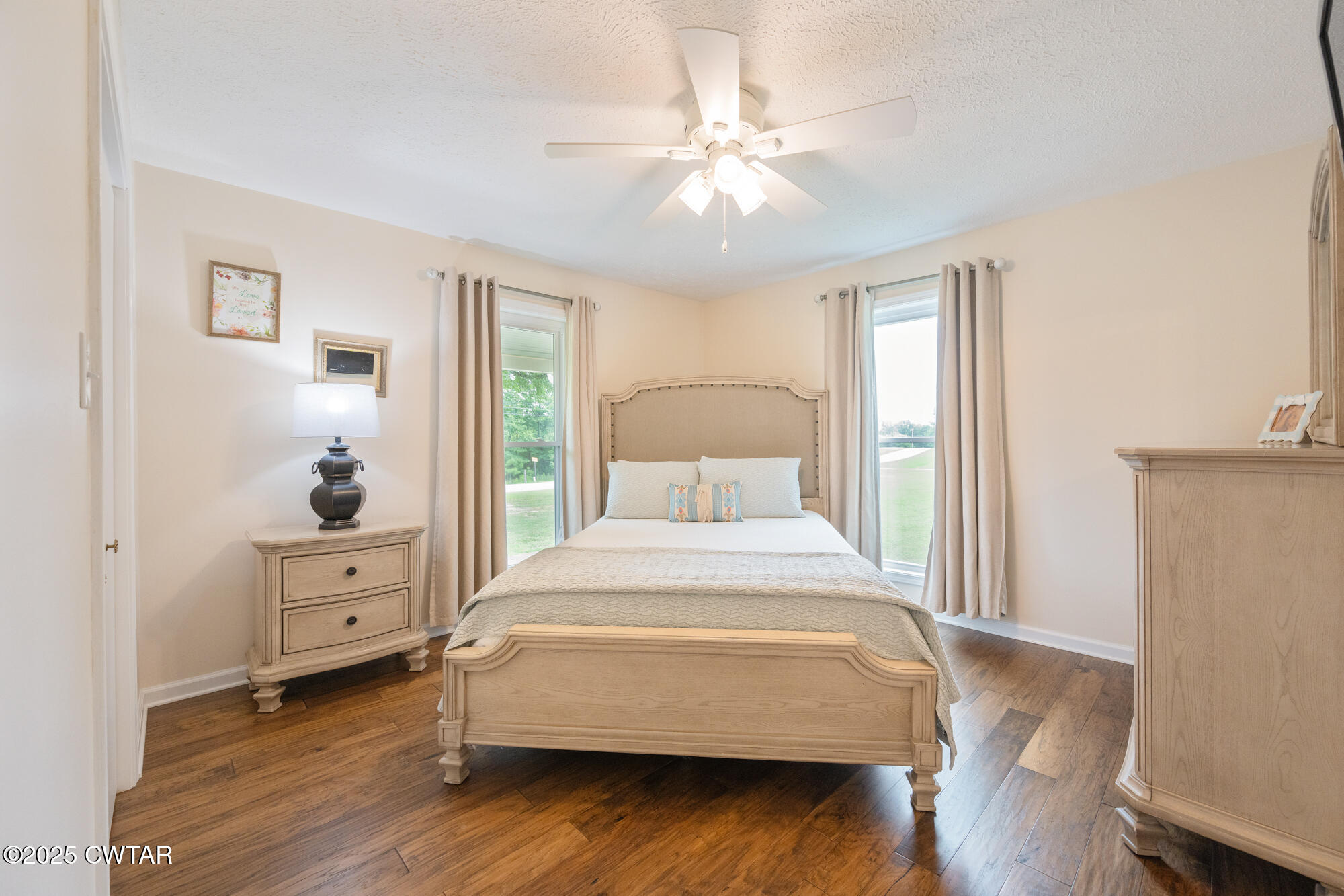 105 Center Hill-Wright Road Reagan, TN 38368 - Photo 24 of 42 a bedroom with a bed and a chandelier