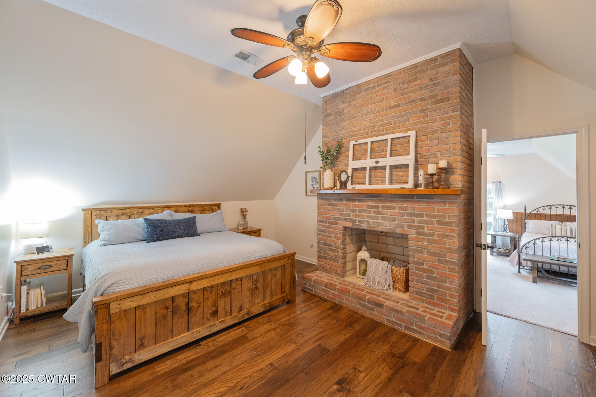 105 Center Hill-Wright Road Reagan, TN 38368 - Photo 27 of 42 a bedroom with a bed and a fireplace