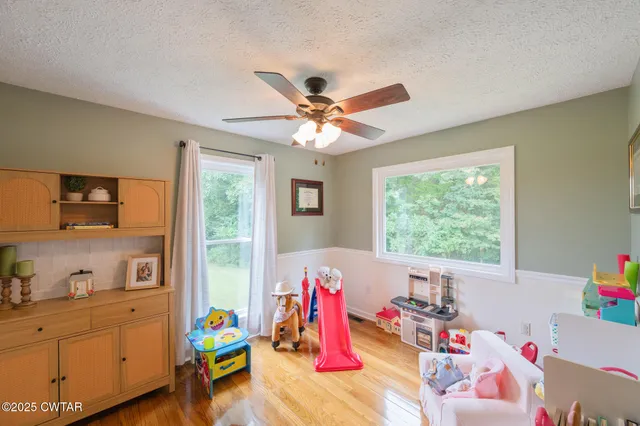 a view of balcony with furniture and wooden floor