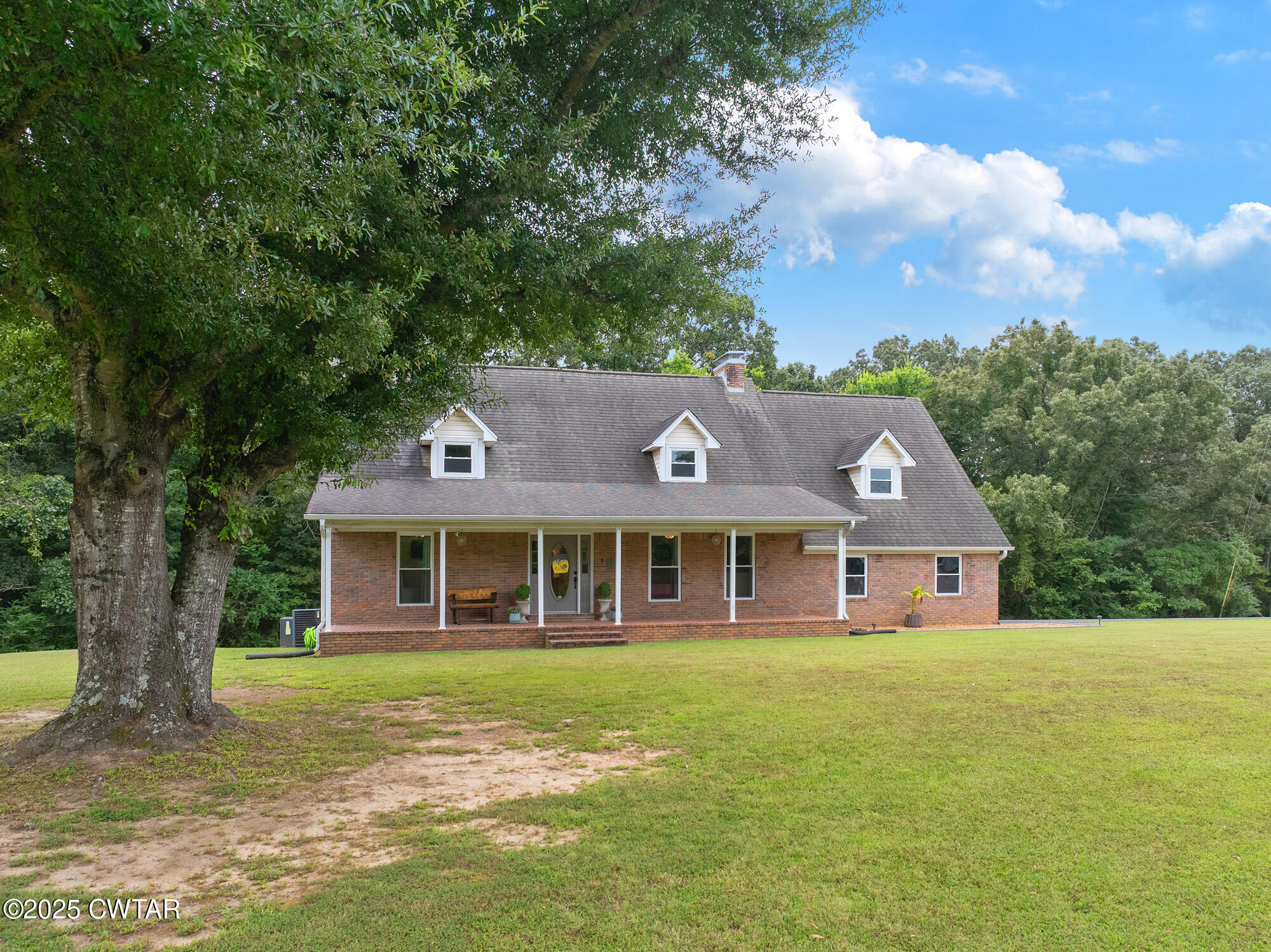105 Center Hill-Wright Road Reagan, TN 38368 - Photo 5 of 42 a front view of a house with a garden