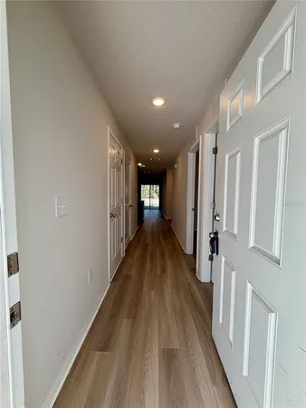a view of gallery with wooden floor