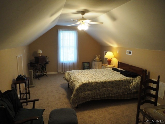 1585 Copper Line Road Bumpass, VA 23024 - Photo 19 of 24 a bedroom with bed and a chandelier