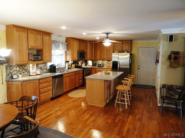 1585 Copper Line Road Bumpass, VA 23024 - Photo 4 of 24 a kitchen with a sink a counter top space a appliances and cabinets