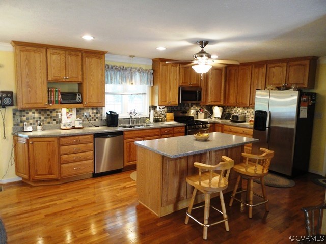 1585 Copper Line Road Bumpass, VA 23024 - Photo 5 of 24 a kitchen with stainless steel appliances granite countertop a sink stove and refrigerator