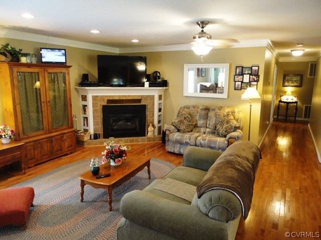 1585 Copper Line Road Bumpass, VA 23024 - Photo 8 of 24 a living room with furniture and a fireplace