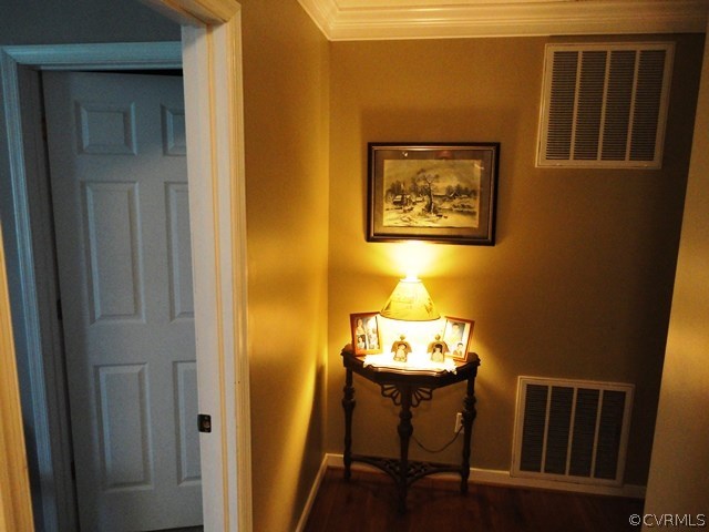 1585 Copper Line Road Bumpass, VA 23024 - Photo 10 of 24 a view of a dining room with furniture and wooden floor