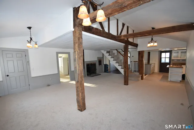 a view of a hallway with seating space