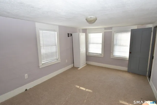 a view of an empty room and window