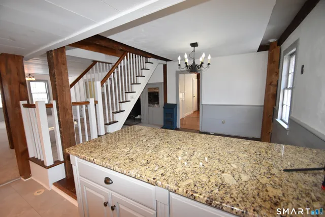 a view of a livingroom from a staircase