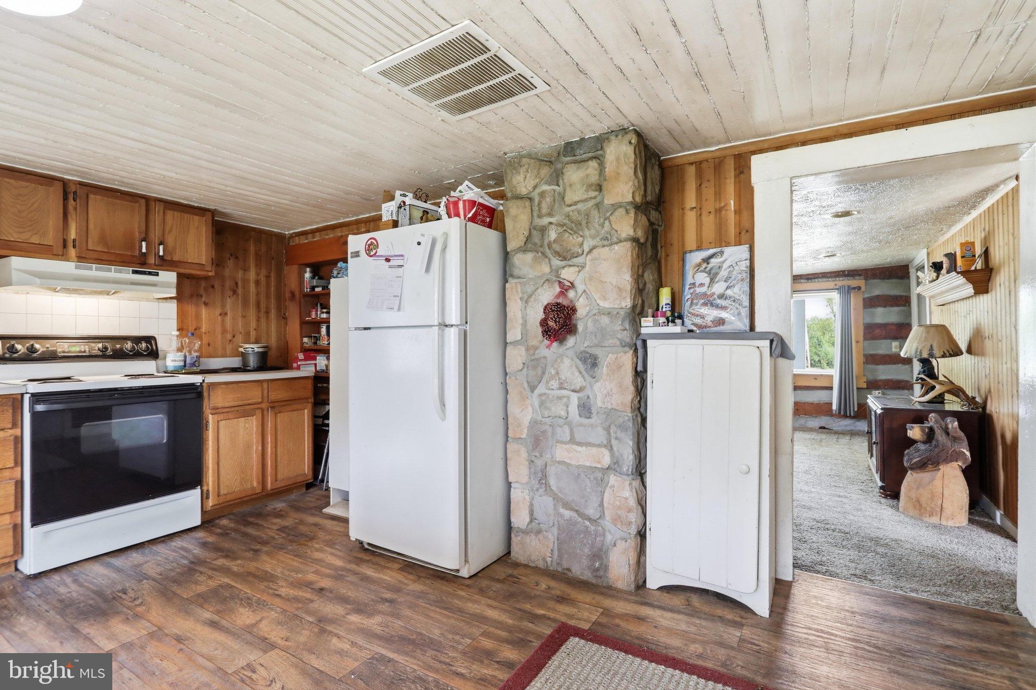 4651 Leetown Road Summit Point, WV 25446 - Photo 17 of 28 Cozy kitchen with rustic charm and warmth.