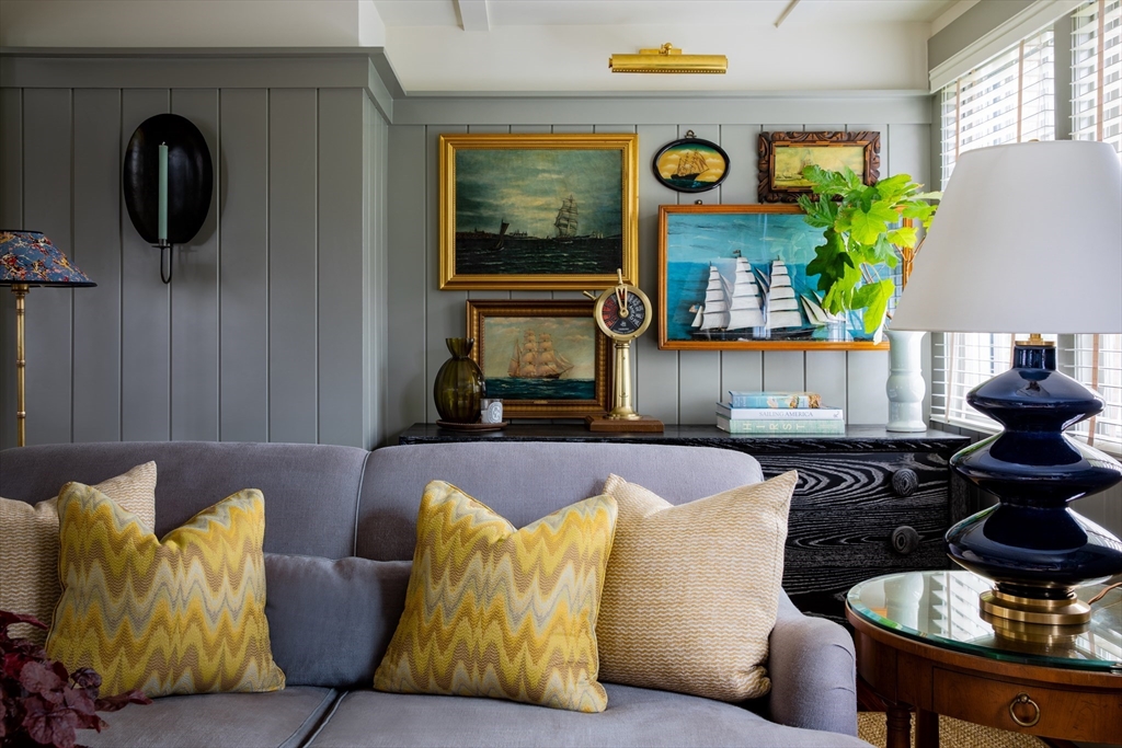 77 Sparks Avenue Nantucket, MA 02554 - Photo 1 of 30 a living room with furniture and wall paintings