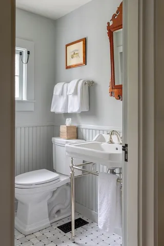 a bathroom with a sink toilet and vanity