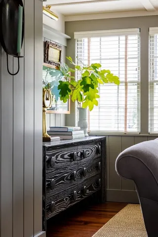 a view of a kitchen area with furniture and a potted plant