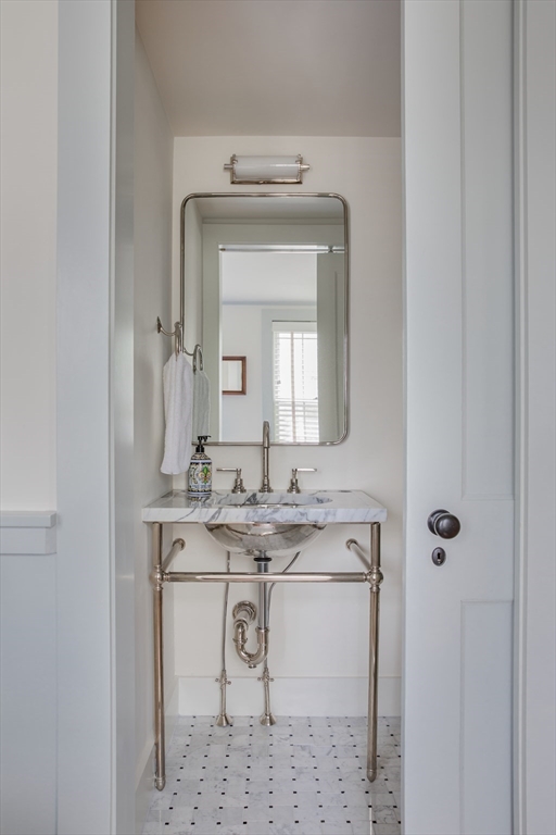 77 Sparks Avenue Nantucket, MA 02554 - Photo 18 of 30 a bathroom with a sink vanity and mirror
