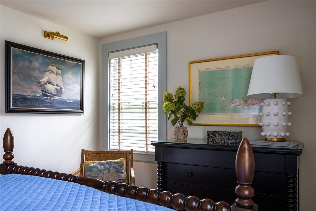 77 Sparks Avenue Nantucket, MA 02554 - Photo 20 of 30 a room with furniture and a potted plant