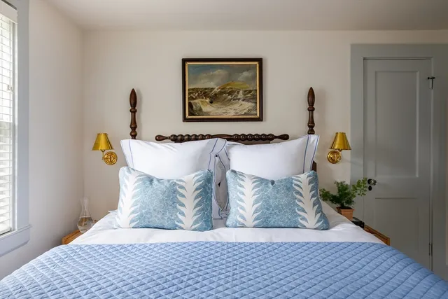 a view of living room with furniture and wooden floor