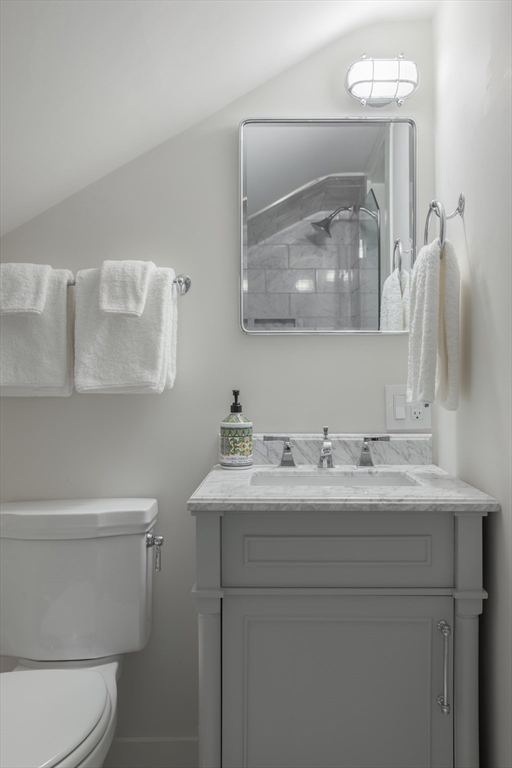 77 Sparks Avenue Nantucket, MA 02554 - Photo 26 of 30 a bathroom with a sink a toilet and a mirror
