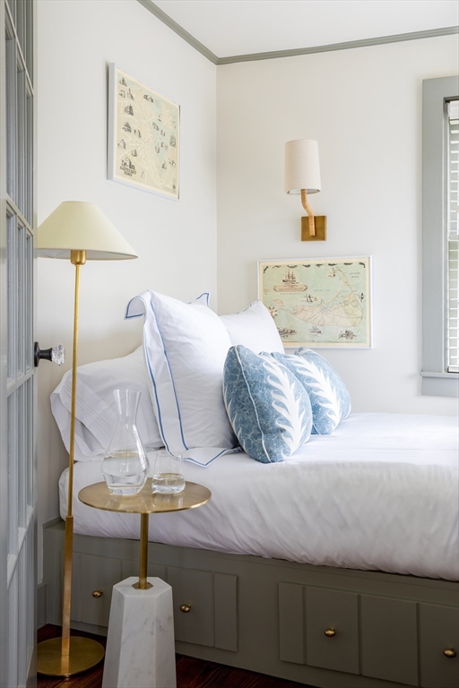77 Sparks Avenue Nantucket, MA 02554 - Photo 28 of 30 a bedroom with a bed and lamp