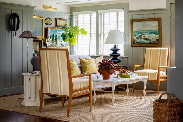 a living room with furniture a window and flat screen tv