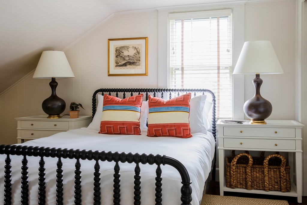 77 Sparks Avenue Nantucket, MA 02554 - Photo 10 of 30 a bedroom with a bed and a painting on the wall