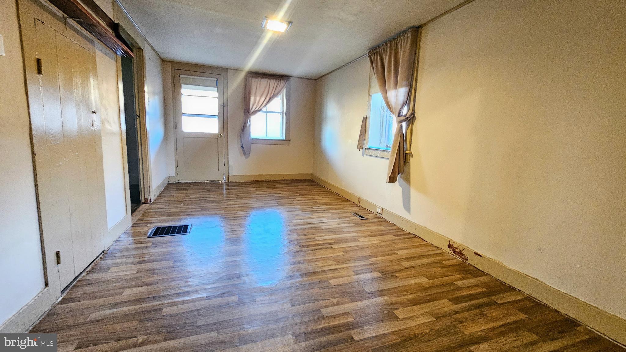 1535 Erney Road Dover, PA 17315 - Photo 11 of 20 a view of an empty room with wooden floor and a window