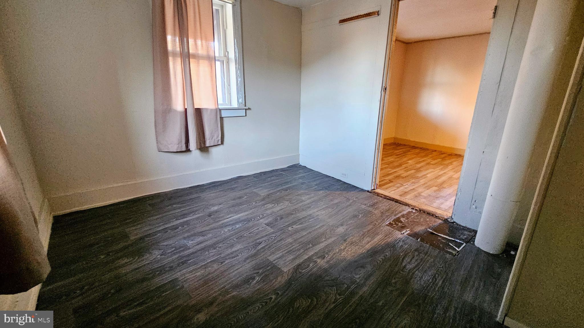 1535 Erney Road Dover, PA 17315 - Photo 15 of 20 a view of an empty room with wooden floor and a window