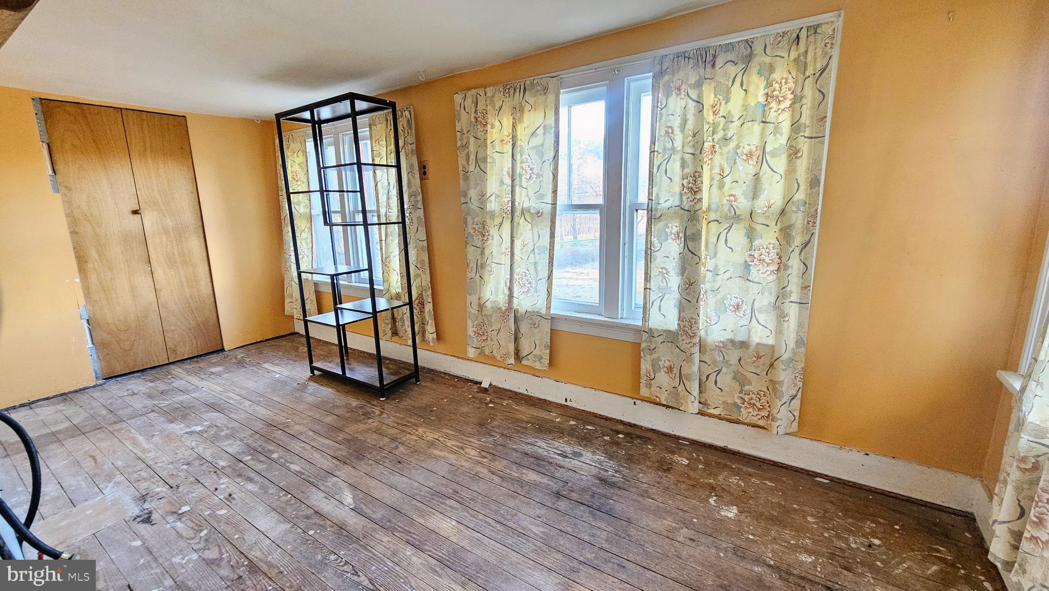 1535 Erney Road Dover, PA 17315 - Photo 7 of 20 an empty room with wooden floor and windows