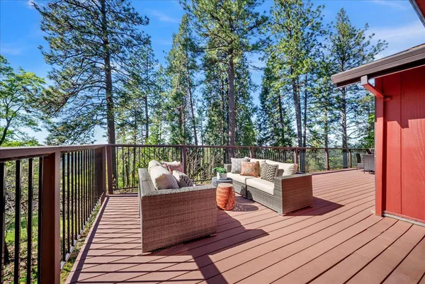a view of a wooden deck with furniture