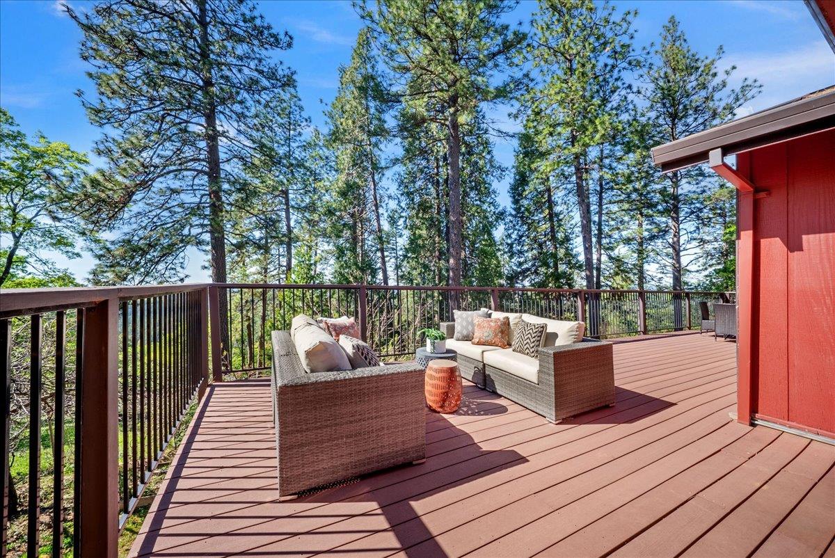 a view of a wooden deck with furniture