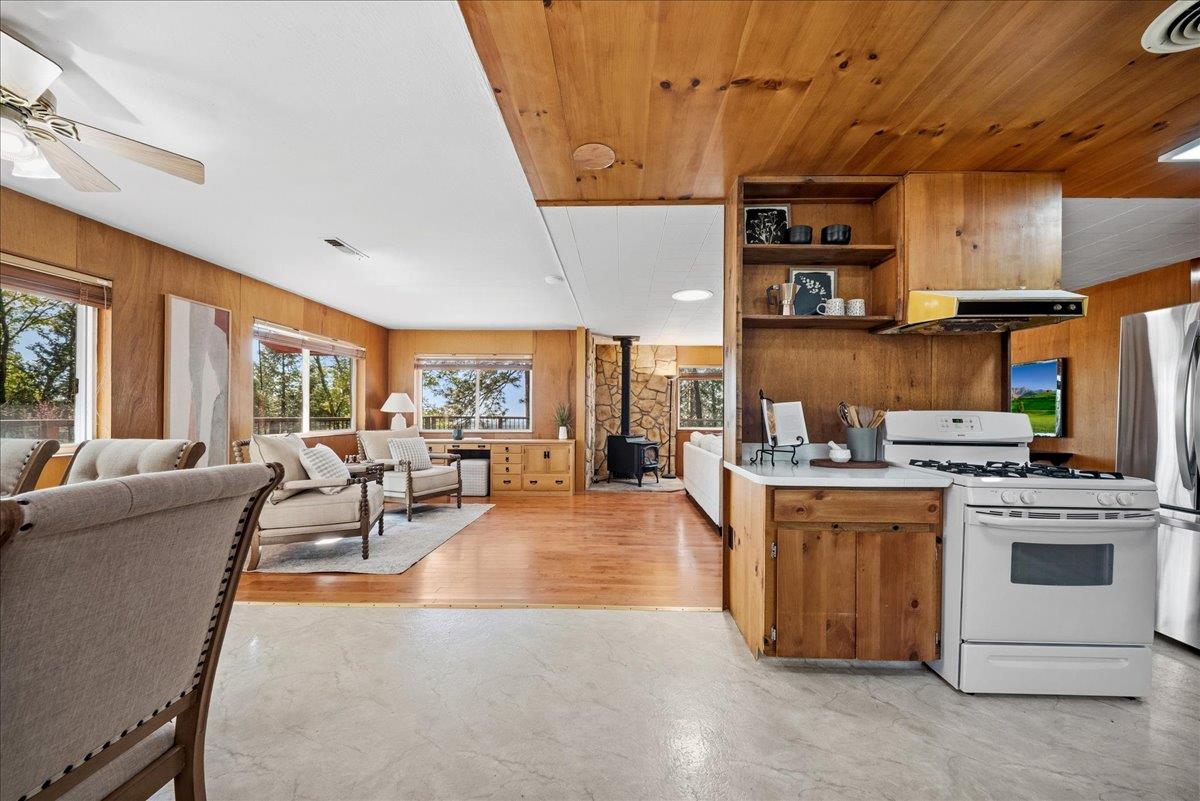 21465 Mason Road Colfax, CA 95713 - Photo 3 of 33 a living room with stainless steel appliances furniture a rug kitchen view and a large window