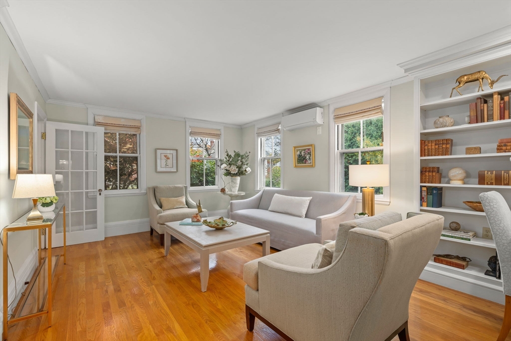 167 Court Street Dedham, MA 02026 - Photo 14 of 42 a living room with furniture and a book shelf