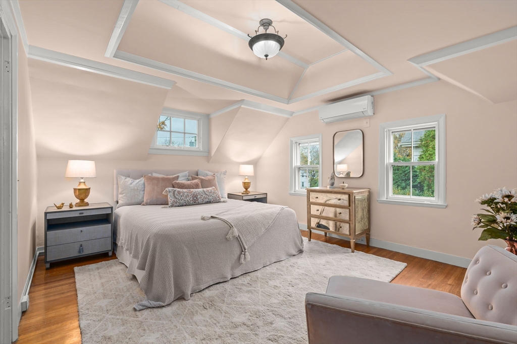 167 Court Street Dedham, MA 02026 - Photo 21 of 42 a bedroom with a bed and wooden floor