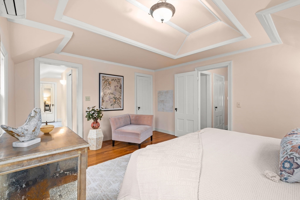 167 Court Street Dedham, MA 02026 - Photo 22 of 42 a bedroom with a bed and a couch