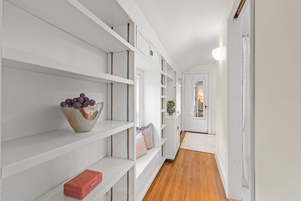 167 Court Street Dedham, MA 02026 - Photo 23 of 42 a view of a hallway with entryway wooden floor and front door