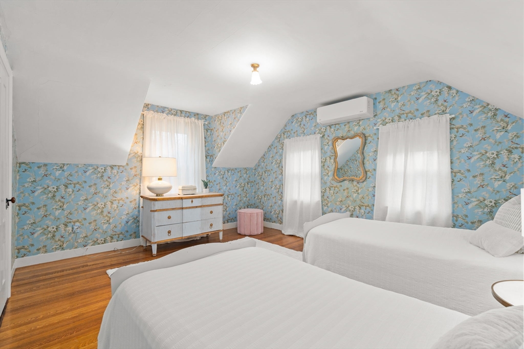 167 Court Street Dedham, MA 02026 - Photo 29 of 42 a bedroom with a bed and a mirror