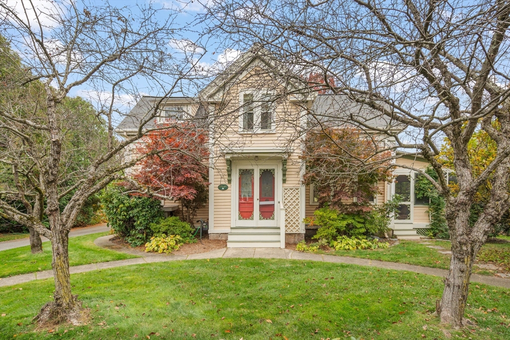 167 Court Street Dedham, MA 02026 - Photo 3 of 42 a front view of a house with garden