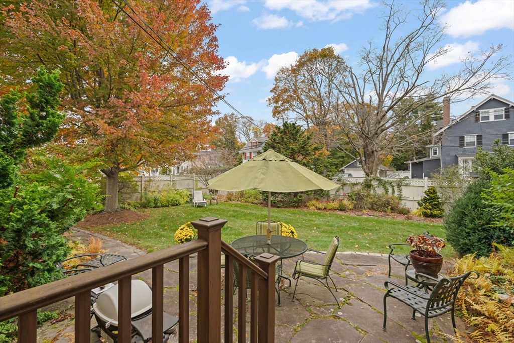 167 Court Street Dedham, MA 02026 - Photo 40 of 42 a view of table and chairs under an umbrella