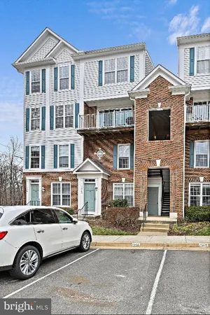 a view of a car parked in front of a building