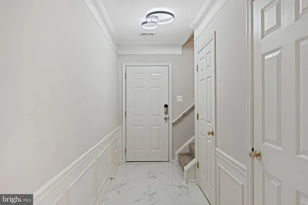 a view of a hallway with two rooms