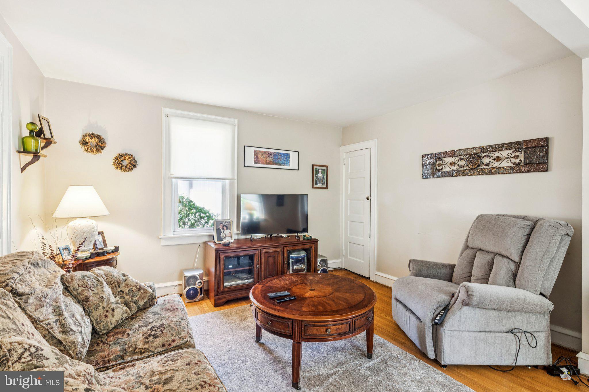 375 Church Road Jenkintown, PA 19046 - Photo 19 of 69 a living room with furniture a window and a flat screen tv