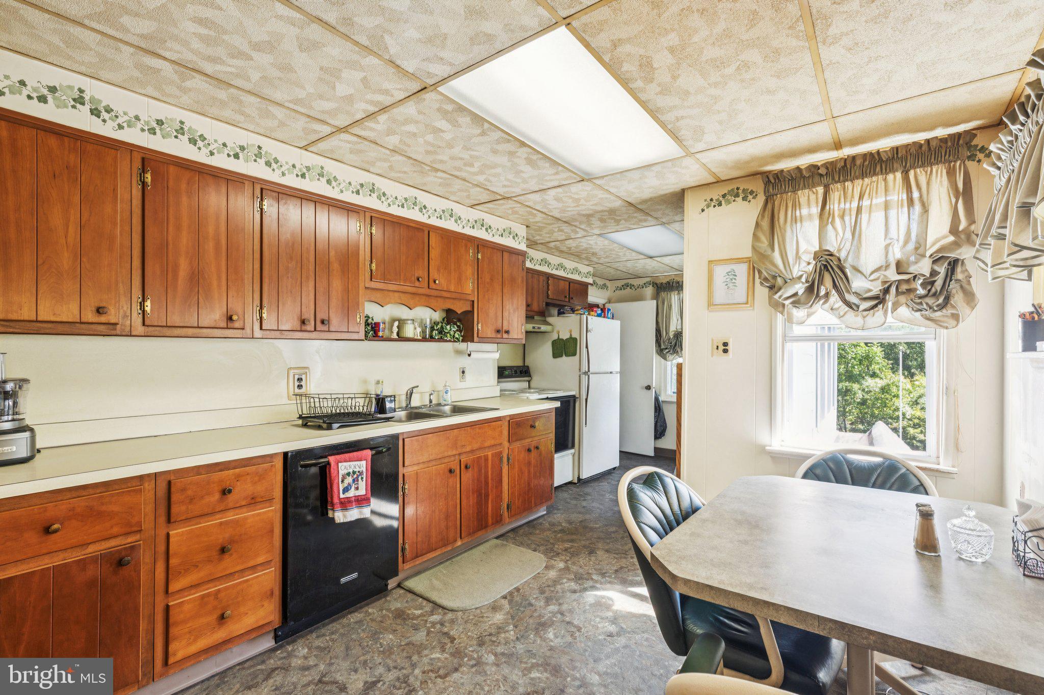 375 Church Road Jenkintown, PA 19046 - Photo 27 of 69 a kitchen with granite countertop a sink a counter space appliances and cabinets
