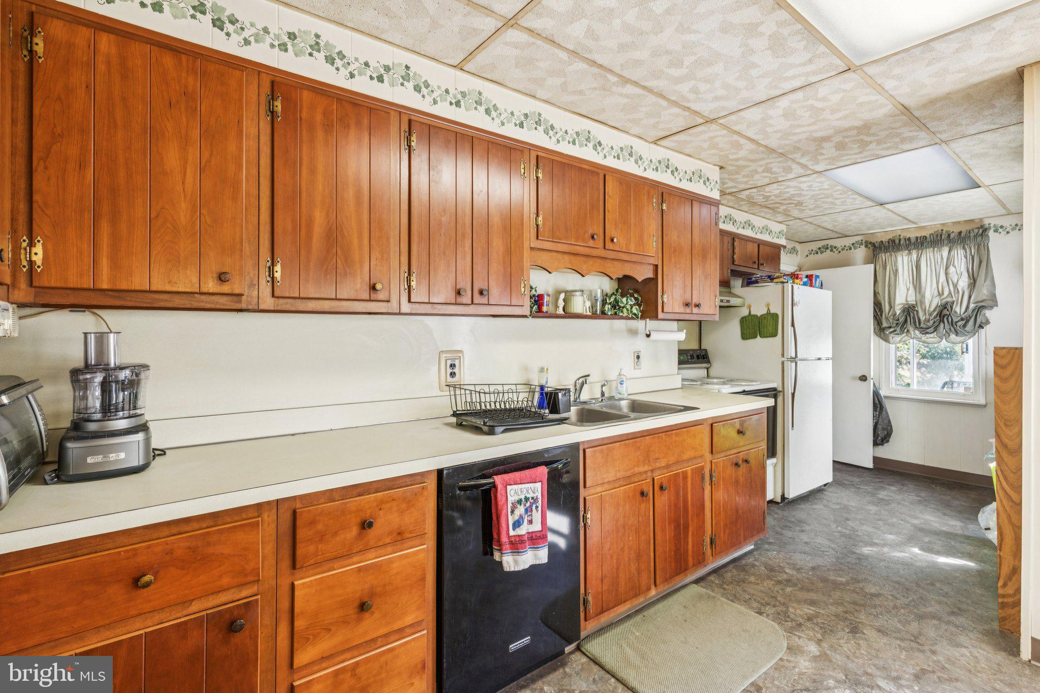 375 Church Road Jenkintown, PA 19046 - Photo 28 of 69 a kitchen with stainless steel appliances granite countertop a sink stove and cabinets