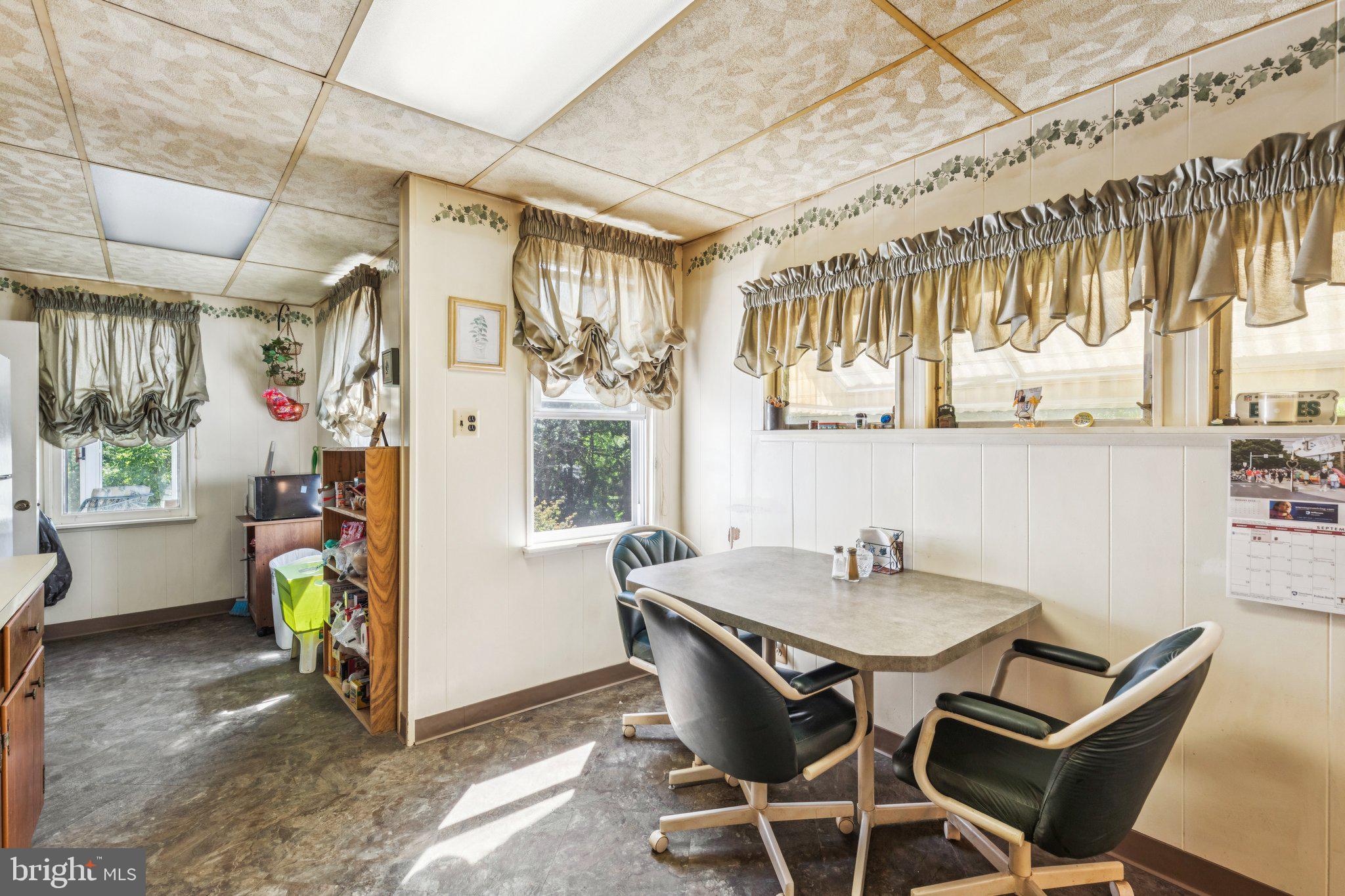 375 Church Road Jenkintown, PA 19046 - Photo 29 of 69 a view of a dining room with furniture a chandelier and wooden floor