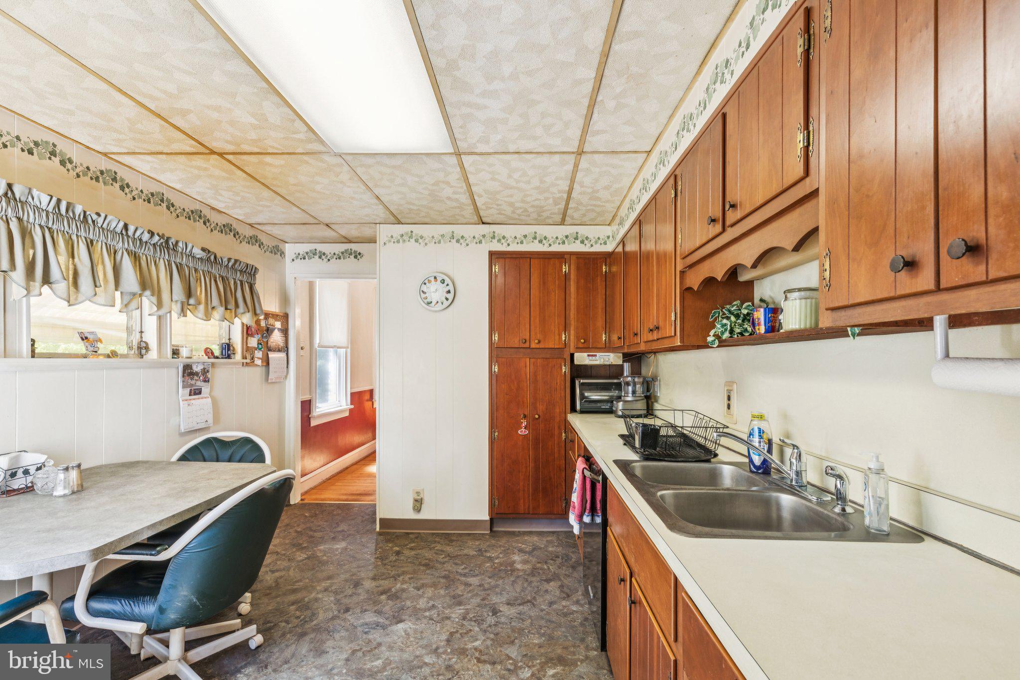 375 Church Road Jenkintown, PA 19046 - Photo 31 of 69 a kitchen that has a sink a stove and chair