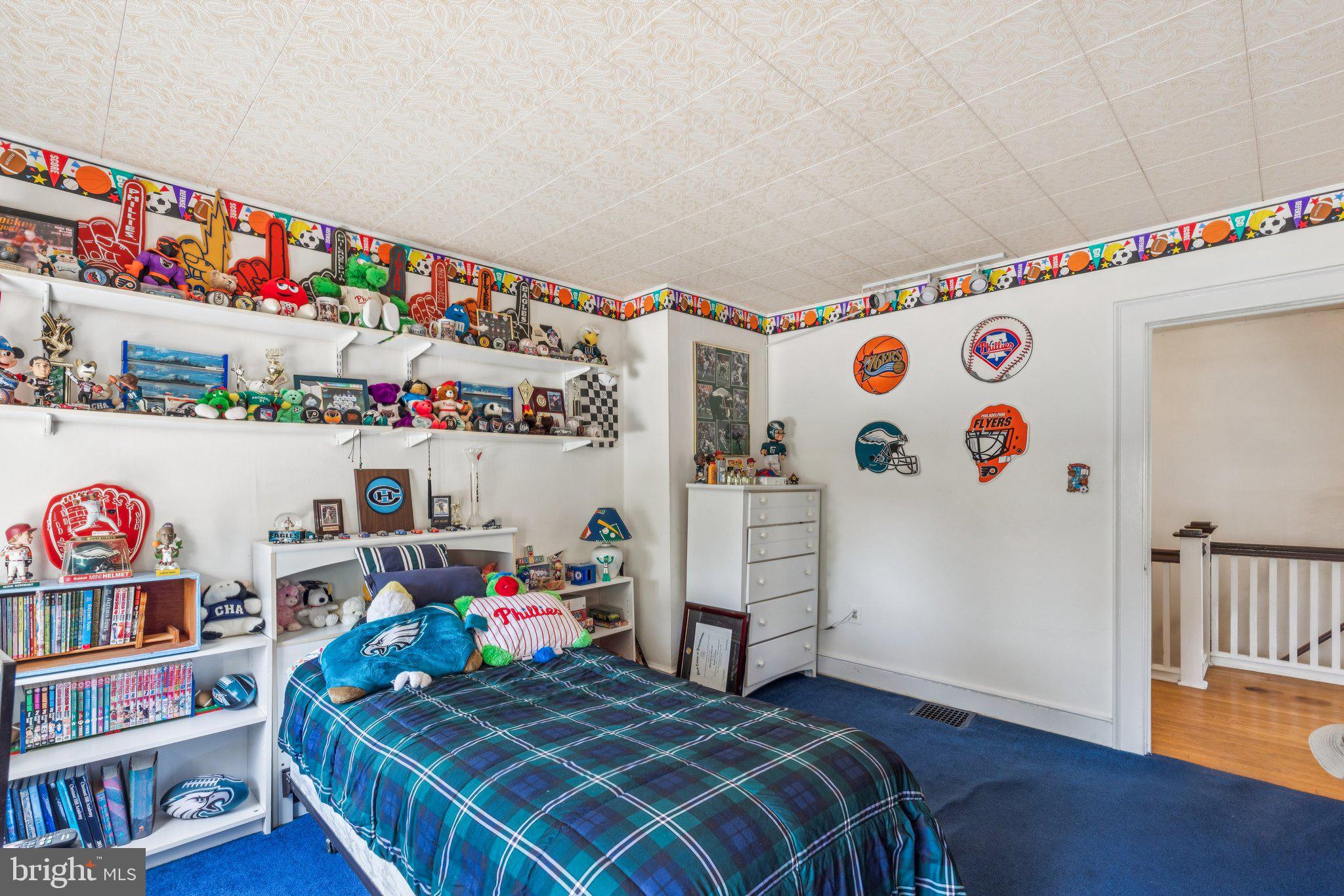 375 Church Road Jenkintown, PA 19046 - Photo 40 of 69 a bedroom with baby bed baby crib and book shelf