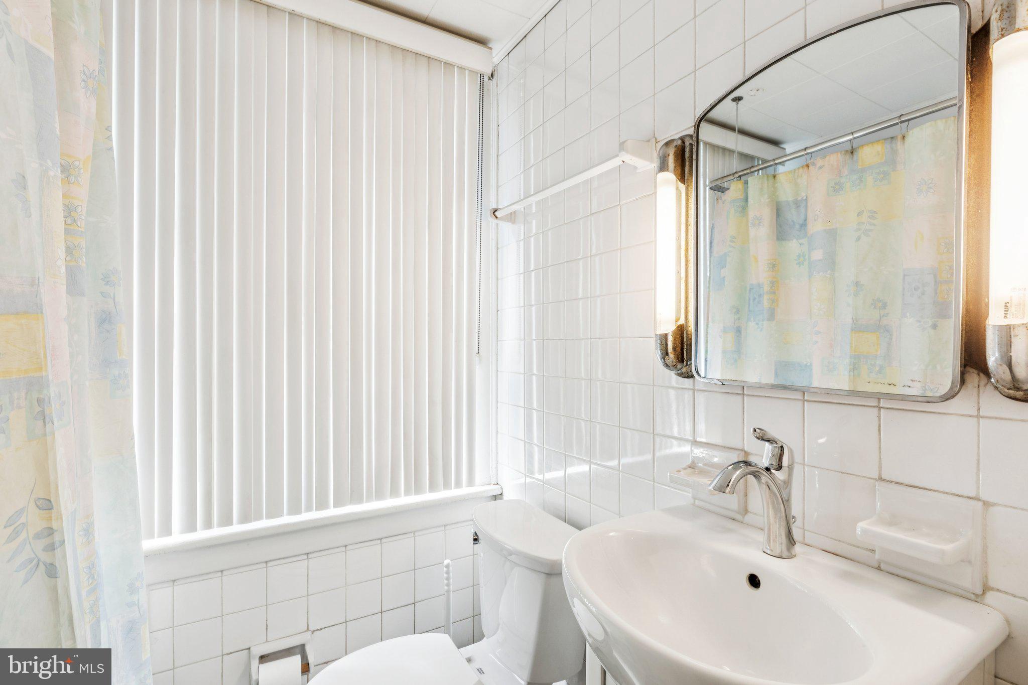 375 Church Road Jenkintown, PA 19046 - Photo 42 of 69 a bathroom with a sink and a mirror