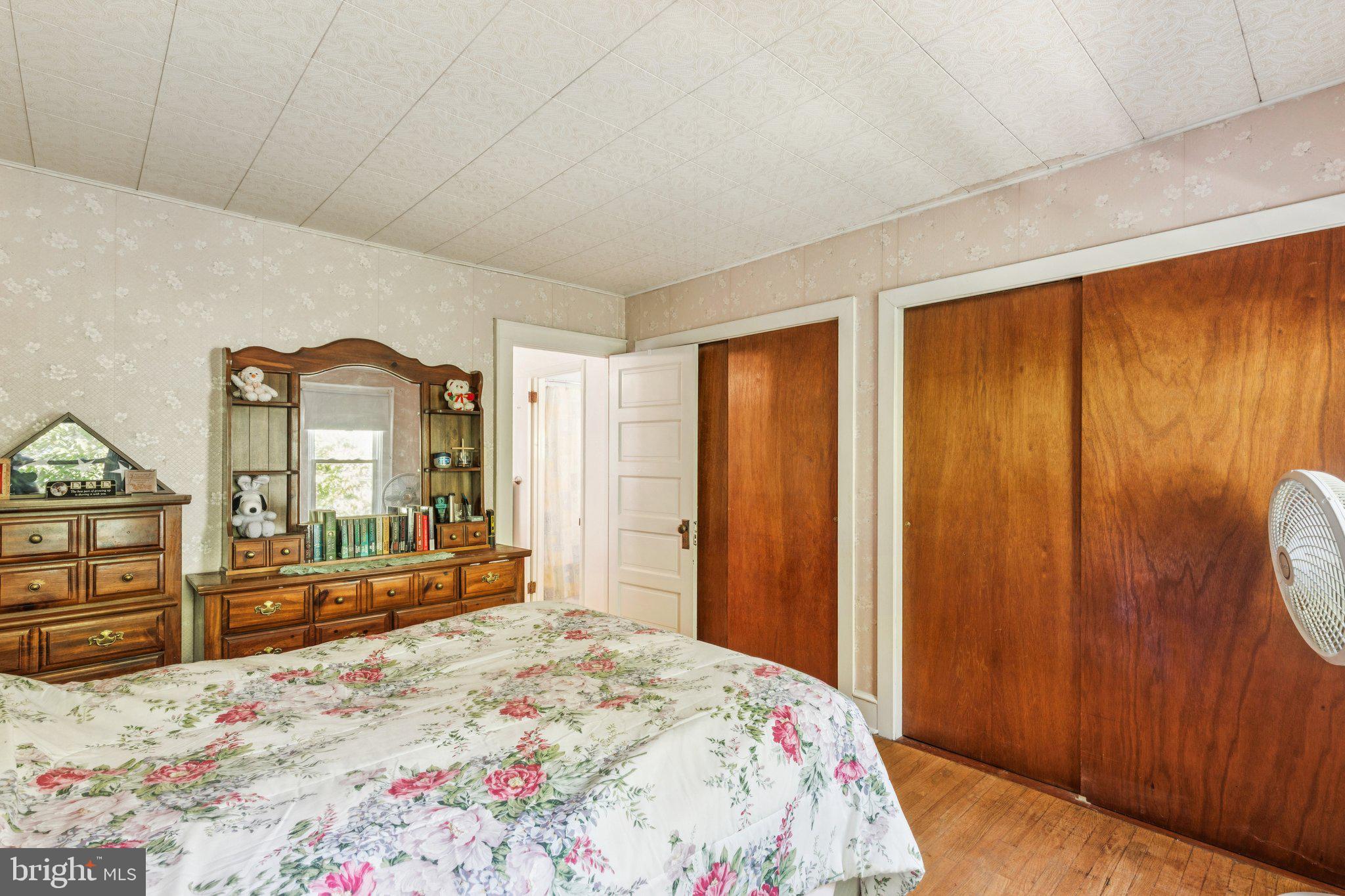 375 Church Road Jenkintown, PA 19046 - Photo 46 of 69 a bedroom with a bed and a dresser with mirror